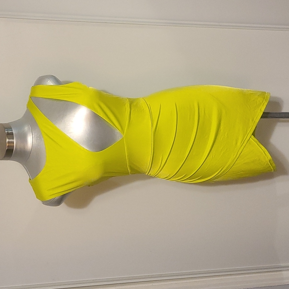Neon yellow front cut out Sleeveless low v neck fitted mini dress.